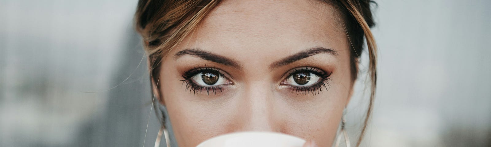 A woman having her coffee