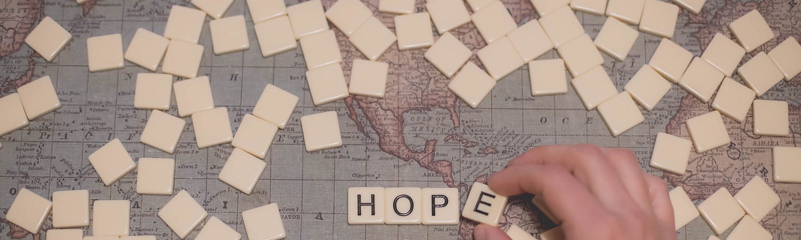 the word hope made of pieces of scrabble tiles