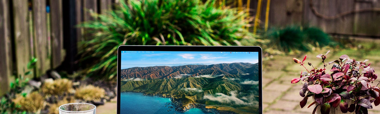 A laptop on a patio.