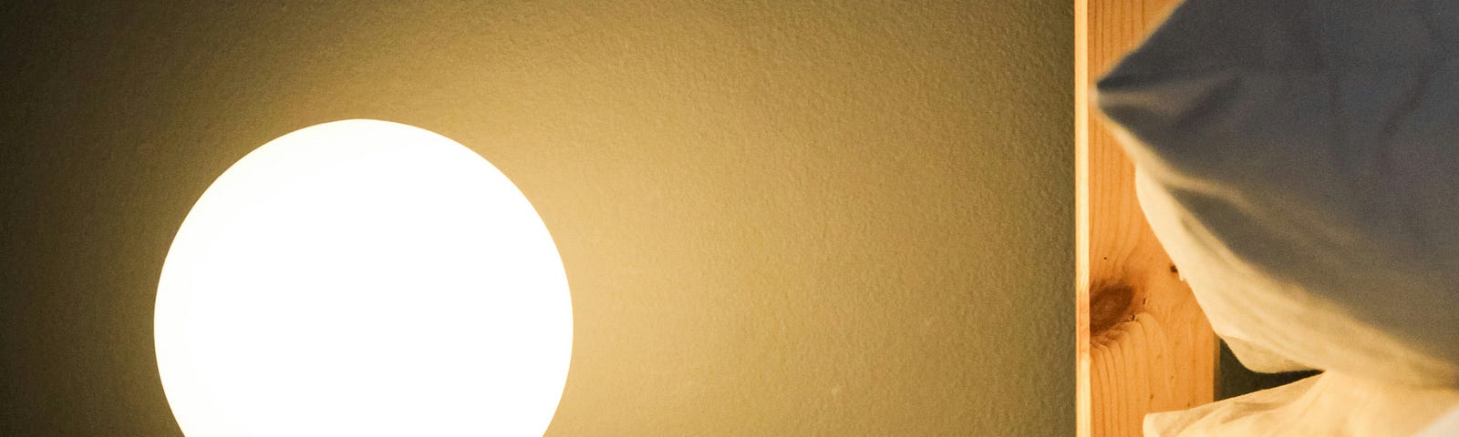 A bright lamp next to the bed.