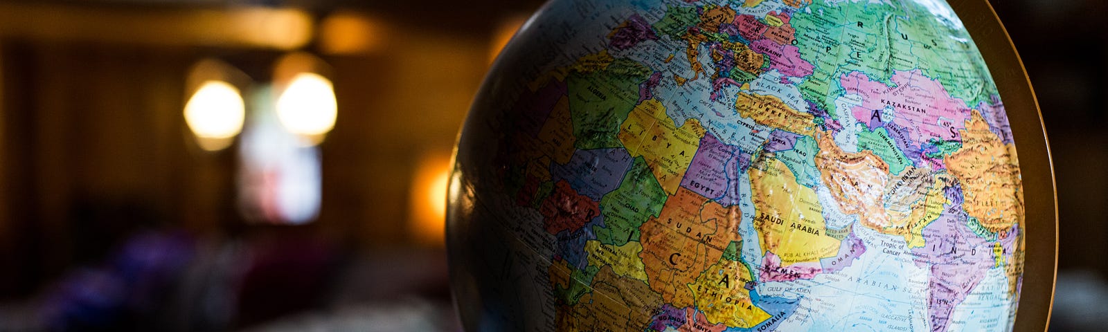 A picture of a globe in blurred room.