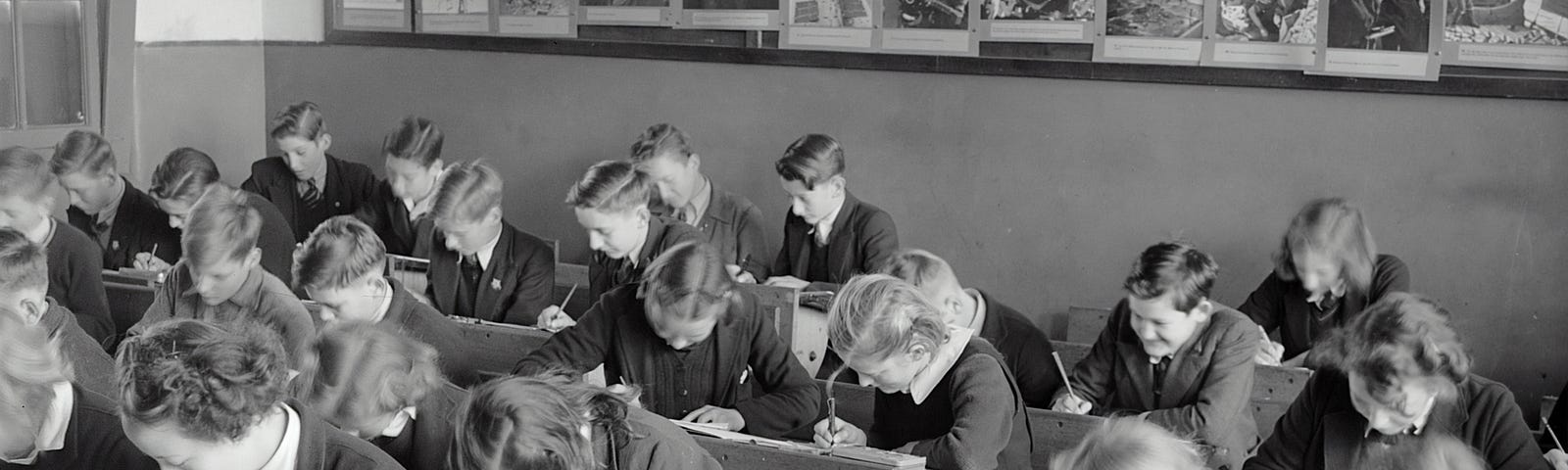 50s-era classroom with homogenous white students working with their heads down