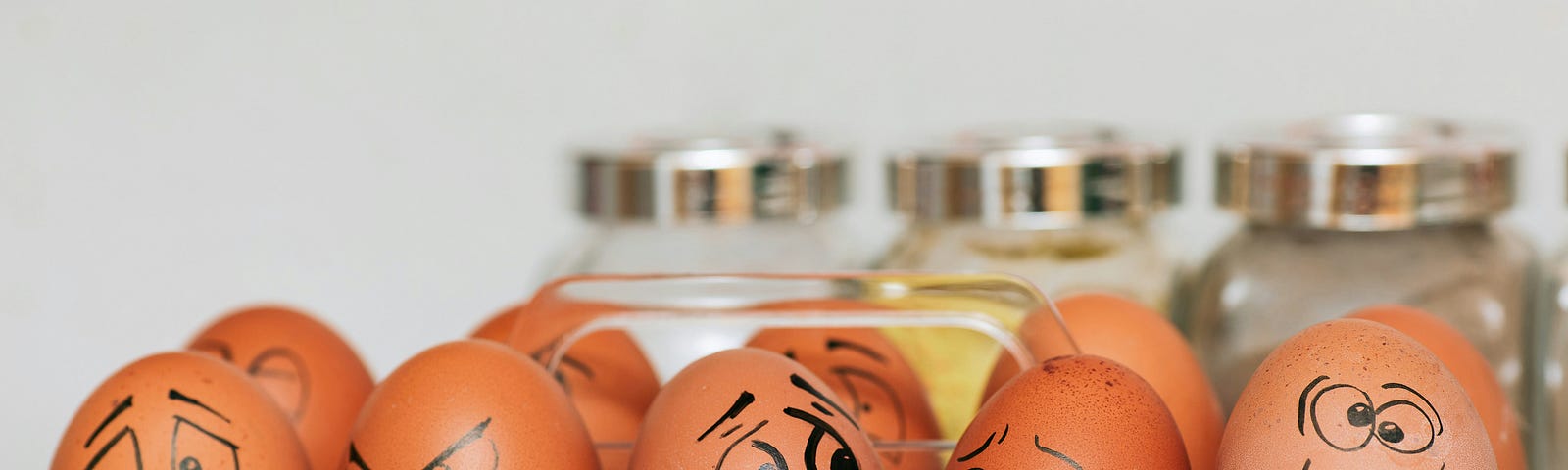 A picture of eggs with silly faces painted thereon via Alt text on Medium