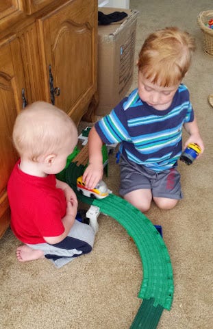 toddlers playing trains