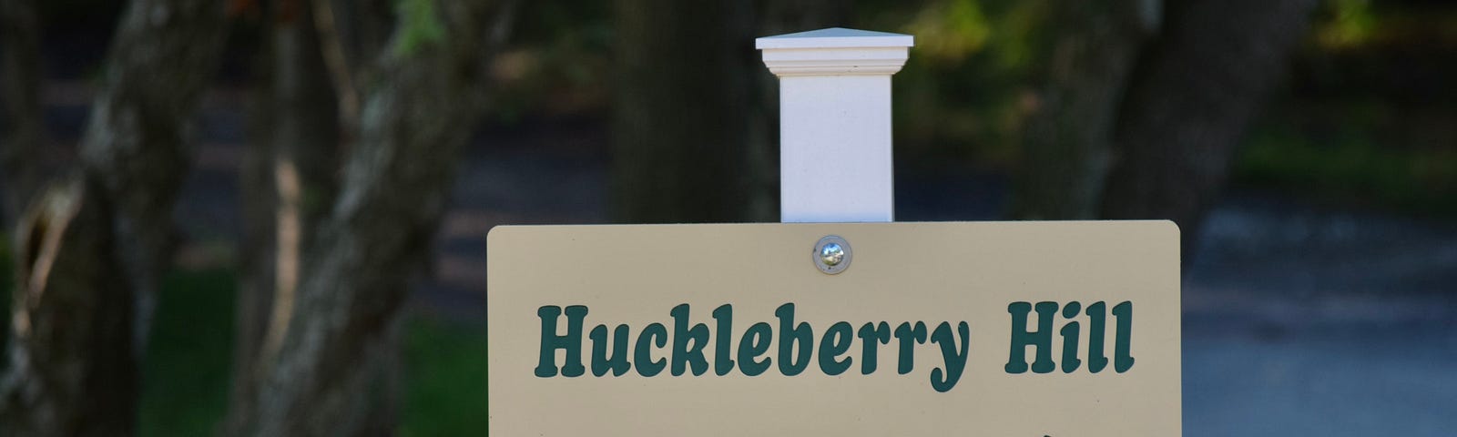 sign says “Huckleberry Hill”