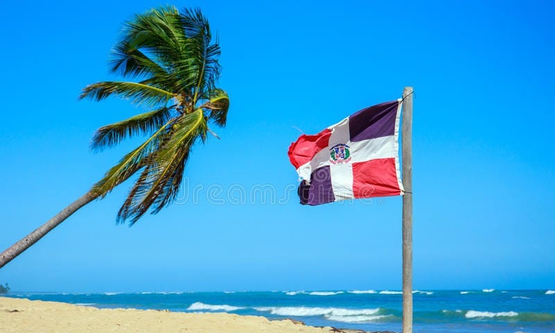 Dominican Republic Flag on a Sunny Beach