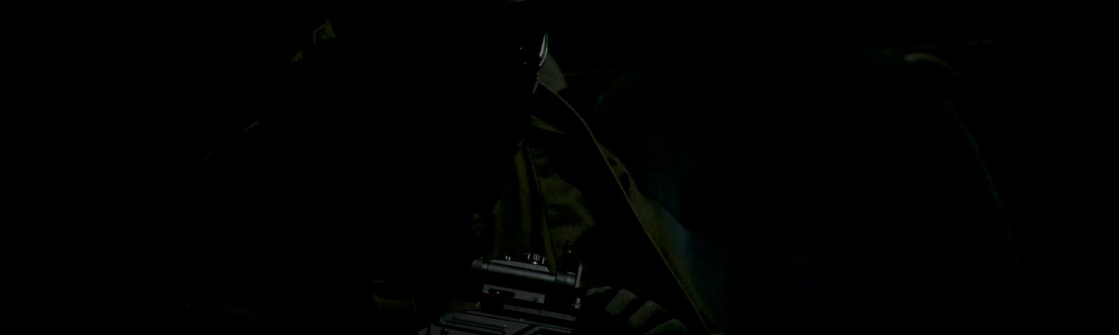 A ghostly figure holding a military-style rifle.