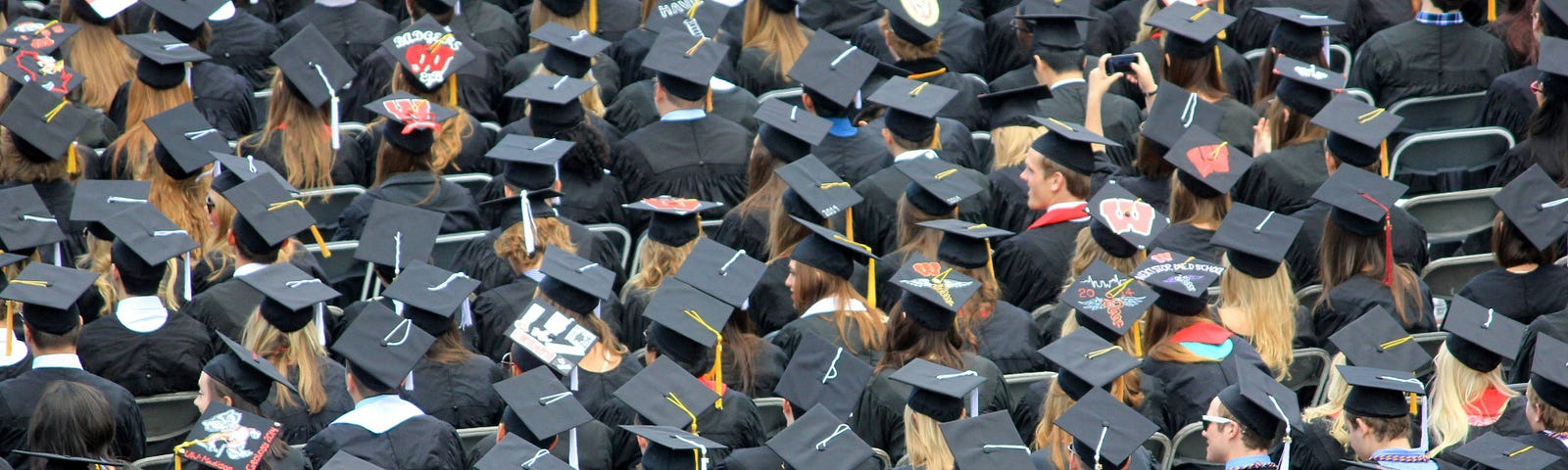 Graduates as seen from above, caps and tassels visible