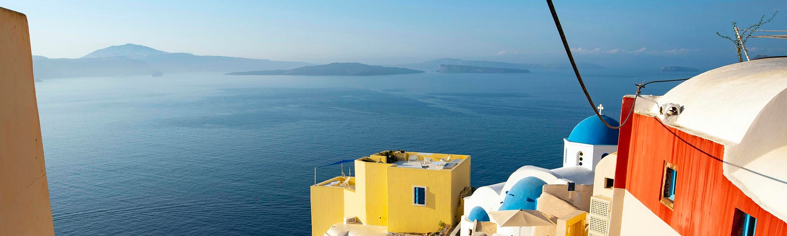 A picture of some buildings in Santorini overlooking the ocean
