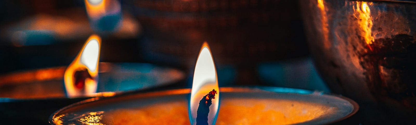 Candles are lit in separate bowls.