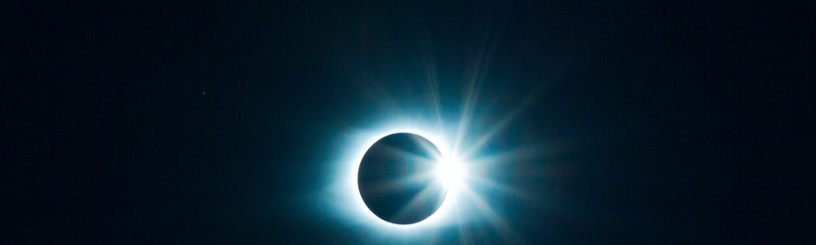 A solar eclipse of Planet Earth as seen from space.