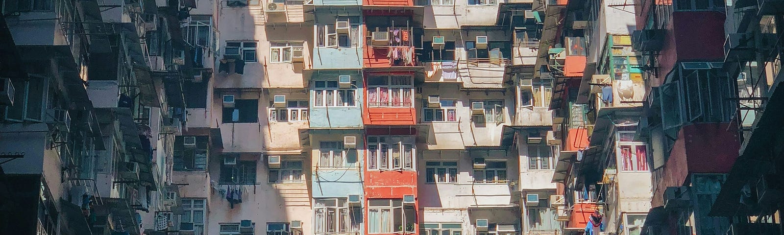 A densely packed apartment building in Hong Kong.