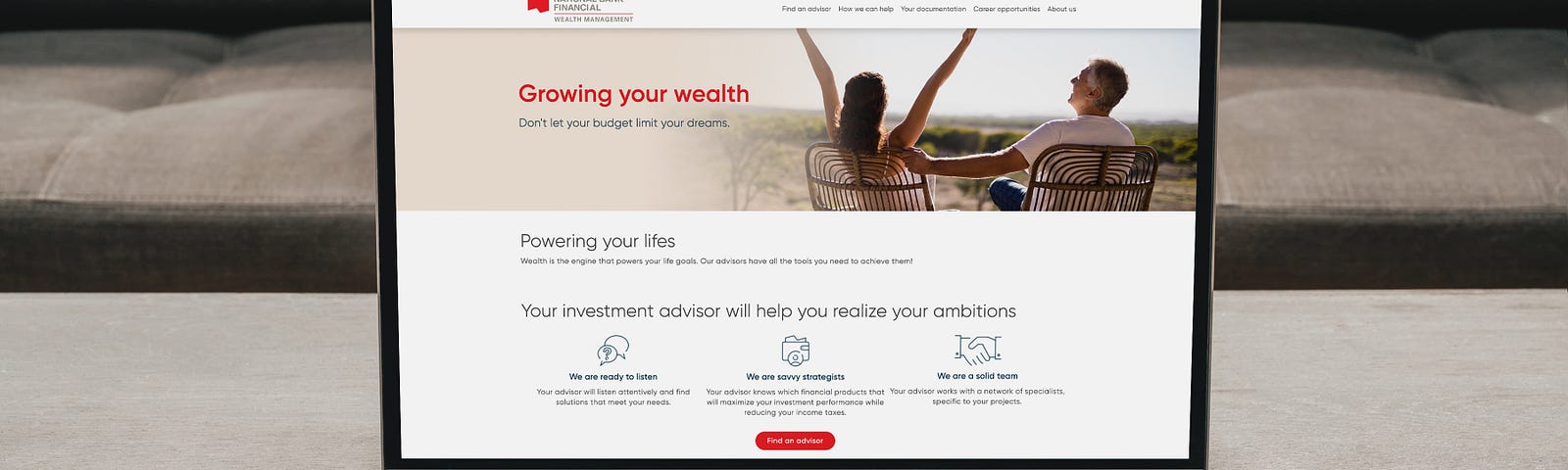 Computer monitor with woman raising arms, man next to her, phrase “Growing your wealth”