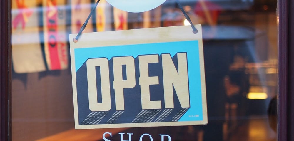 An “open” sign on a shop’s door