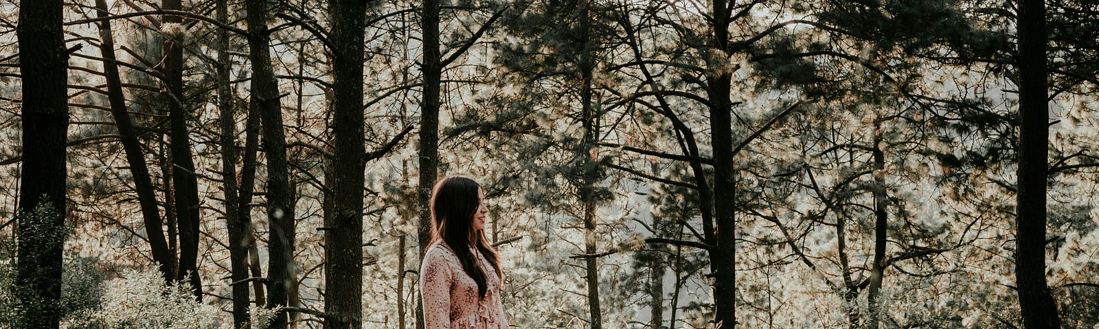 Woman with dog, in woods