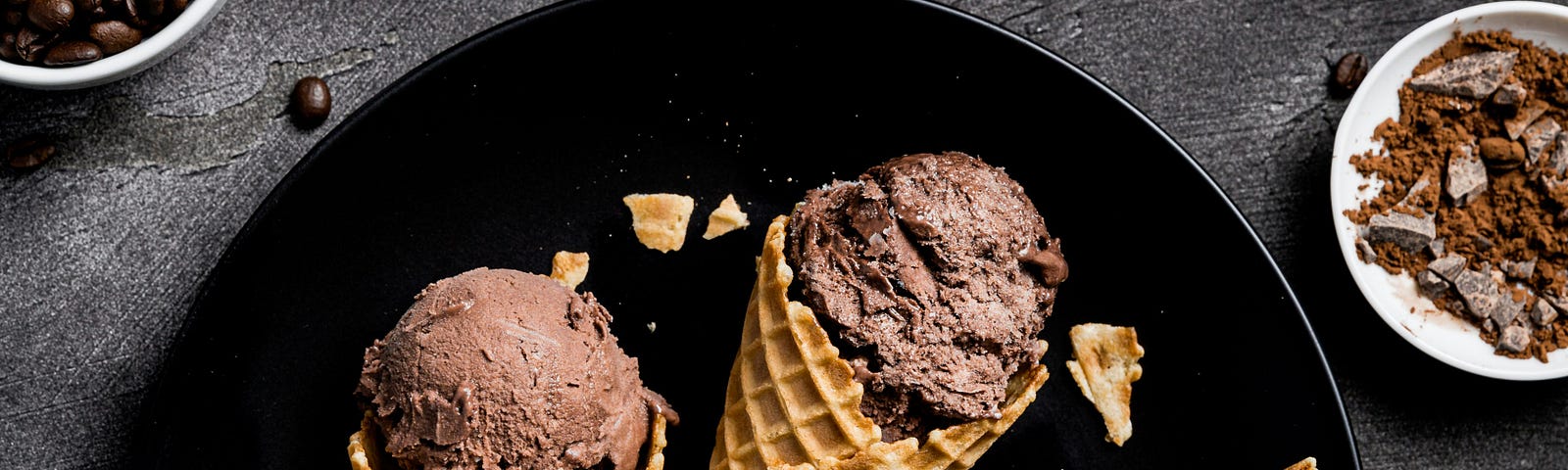 Three chocolate ice cream cones and chocolate beans