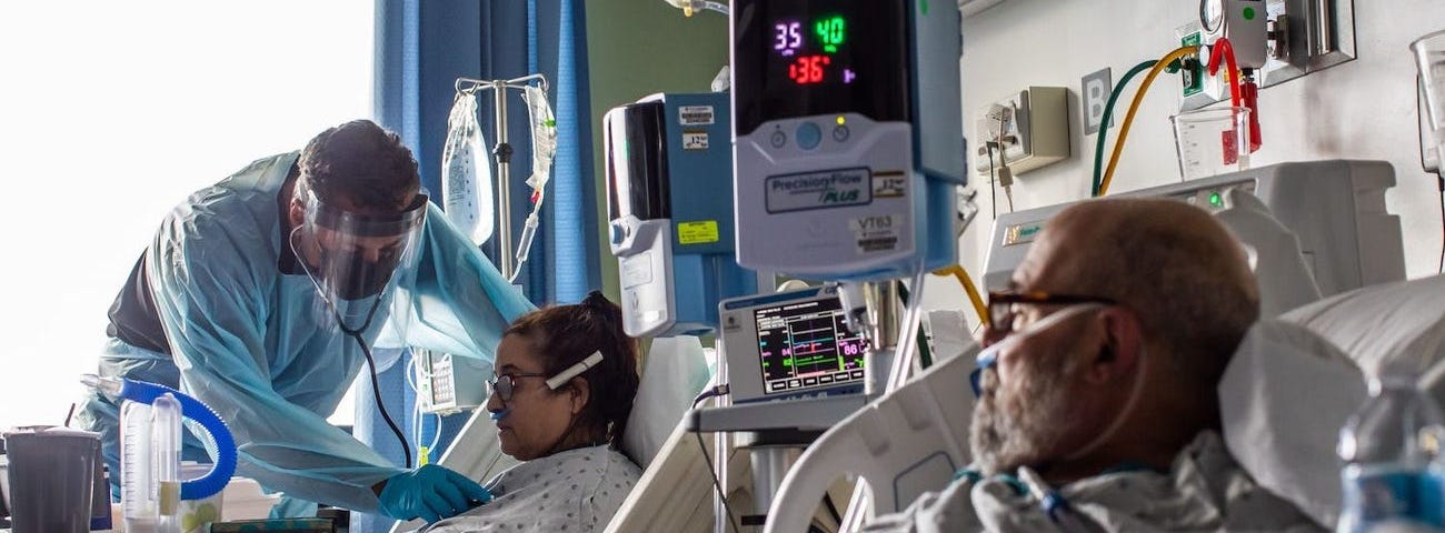 A doctor checks the vital signs of a patient at the ICU of Providence Cedars-Sinai Tarzana Medical Center in California on January 3.
