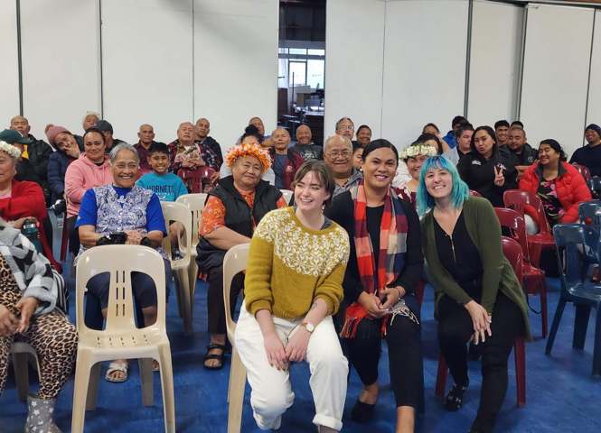 Left to right in front row: Rachel Dickerson, Jaye Moors, and Olivia Gray. Community engagement event at the Pukapuka Community Centre in Māngere, a suburb of Auckland.