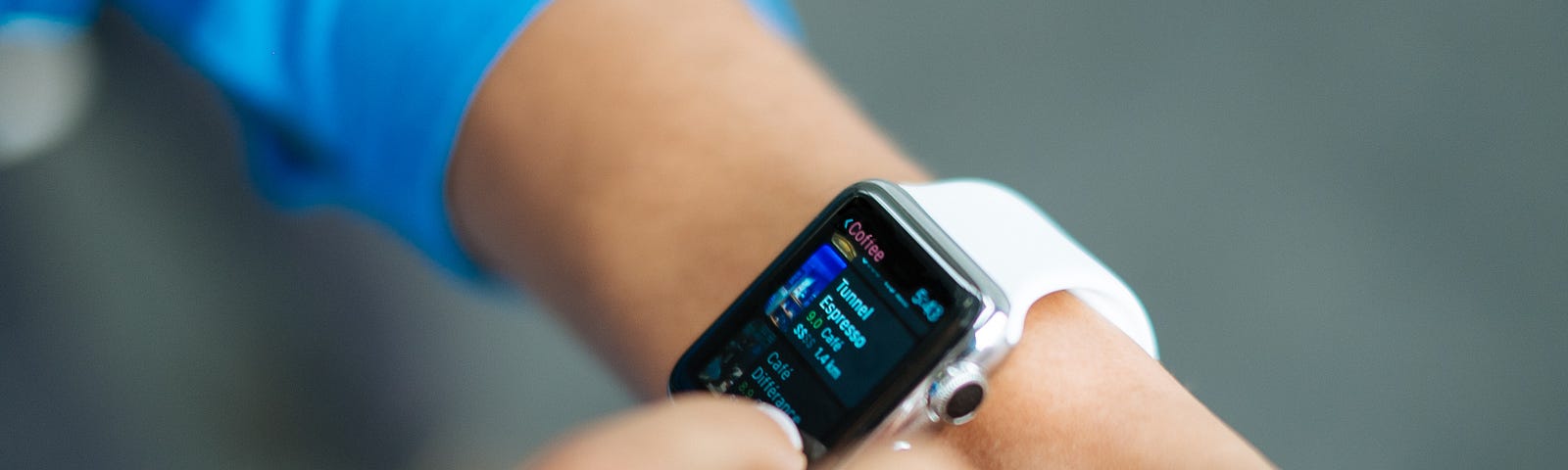 Close-up of Apple Watch on wrist, person shown scrolling.