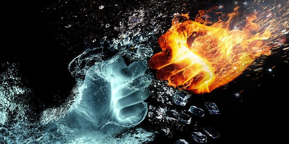 Two fists, one of water one of fire, coming together in battle