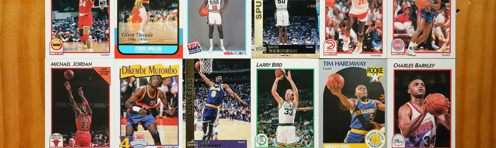 A photo of 18 NBA basketball cards arranged in three rows of six.