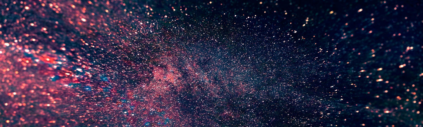 photo of the universe in pink, blue, white, and black