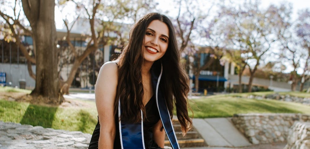 Young Latina college graduate