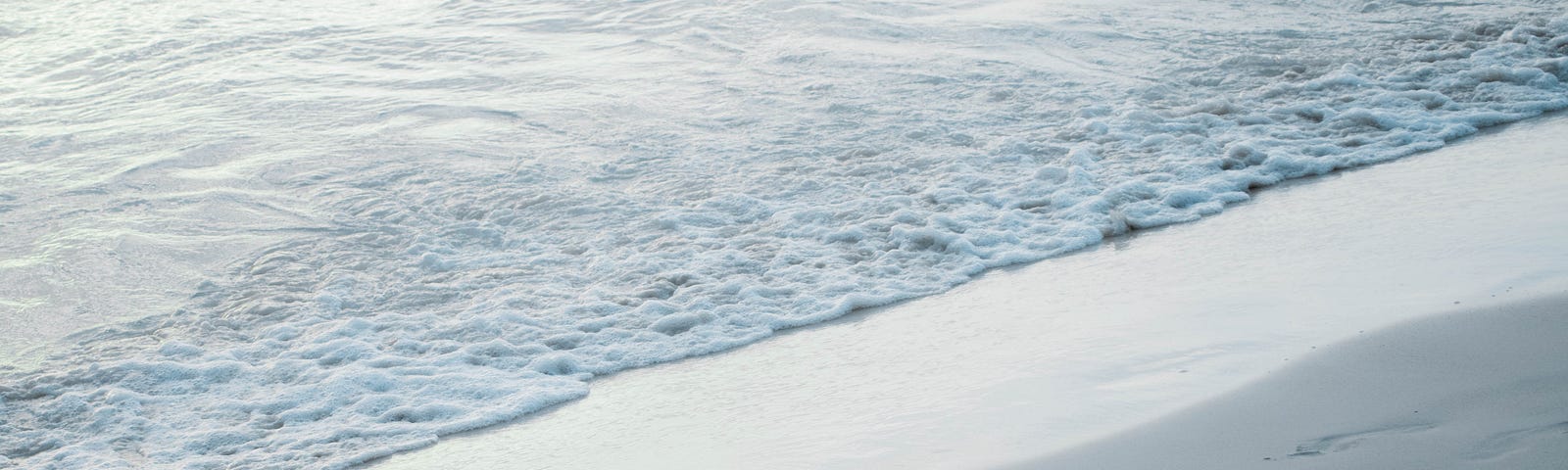 Wave remnants stretching onto the beach