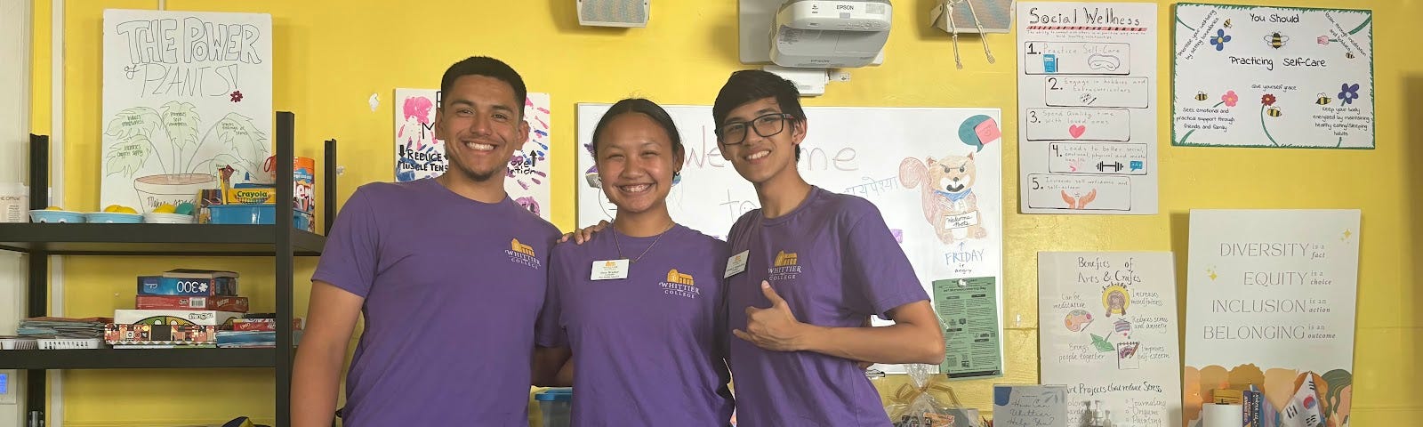 Three Whittier College Peer Health Educator Students pose for a group photo in their office space.