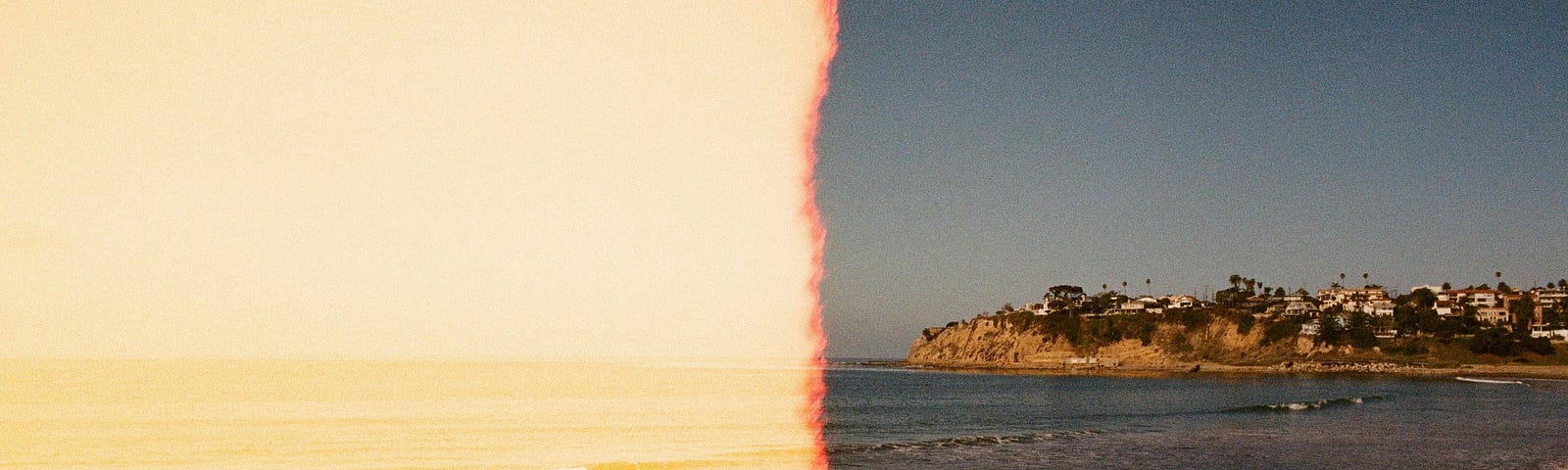 an old photo of a beach, stretching to the right, towards a town. The photo is faded and orange on the left half.