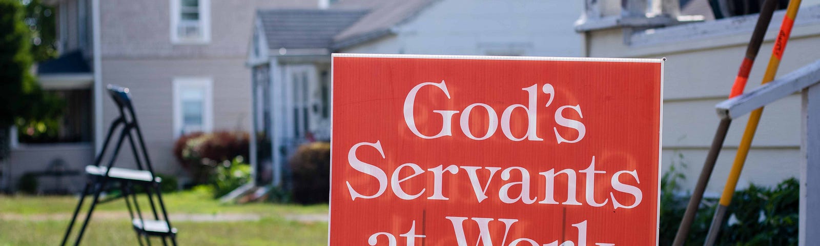 Yard sign of “God’s servants at work.”