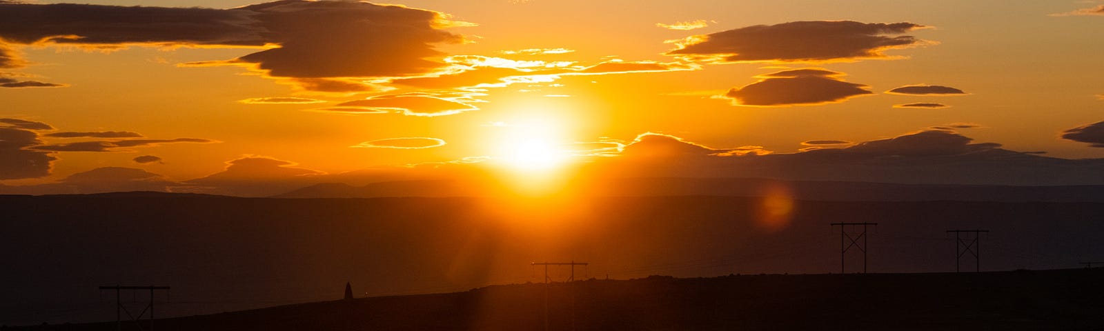 autumn sunset with road to mountains