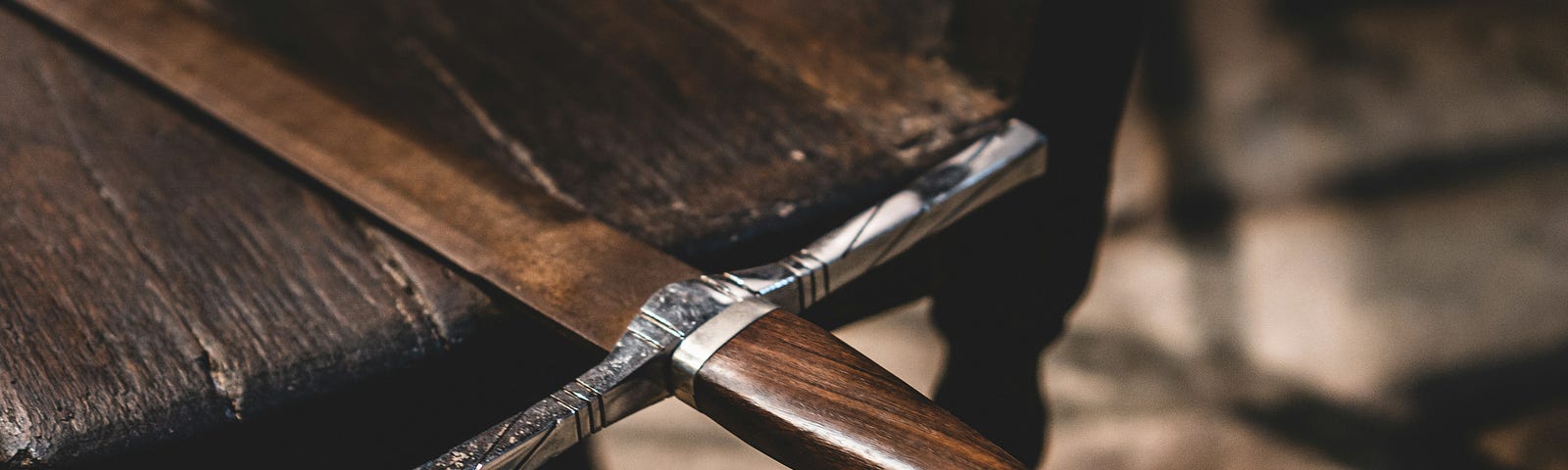 Longsword laying on a wooden table