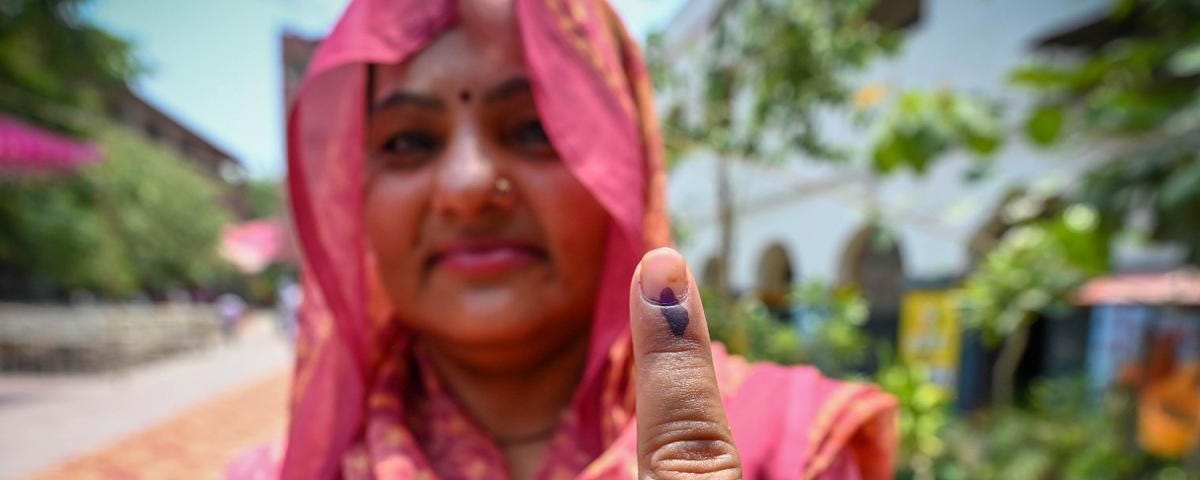 A voter shows her inked finger after casting her vote at a polling station in New Delhi, India, May 25, 2024. Photo by Sanchit Khanna/ Hindustan Times/Sipa USA via Reuters