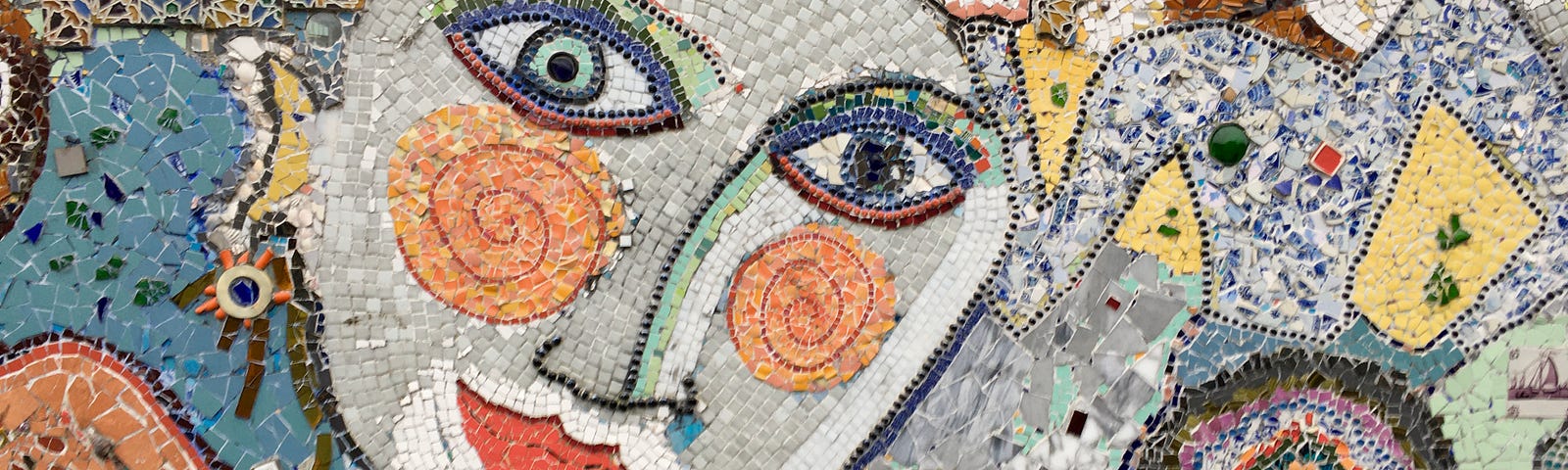 Photo of a mosaic of faces.