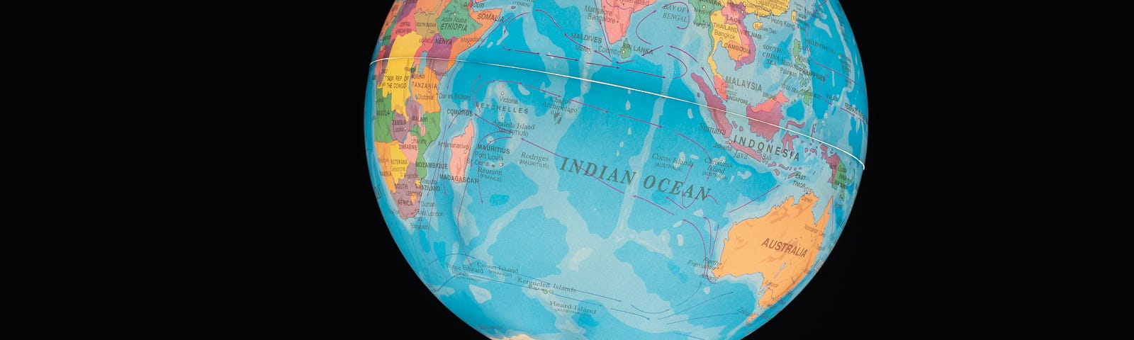 Image of person holding a globe.