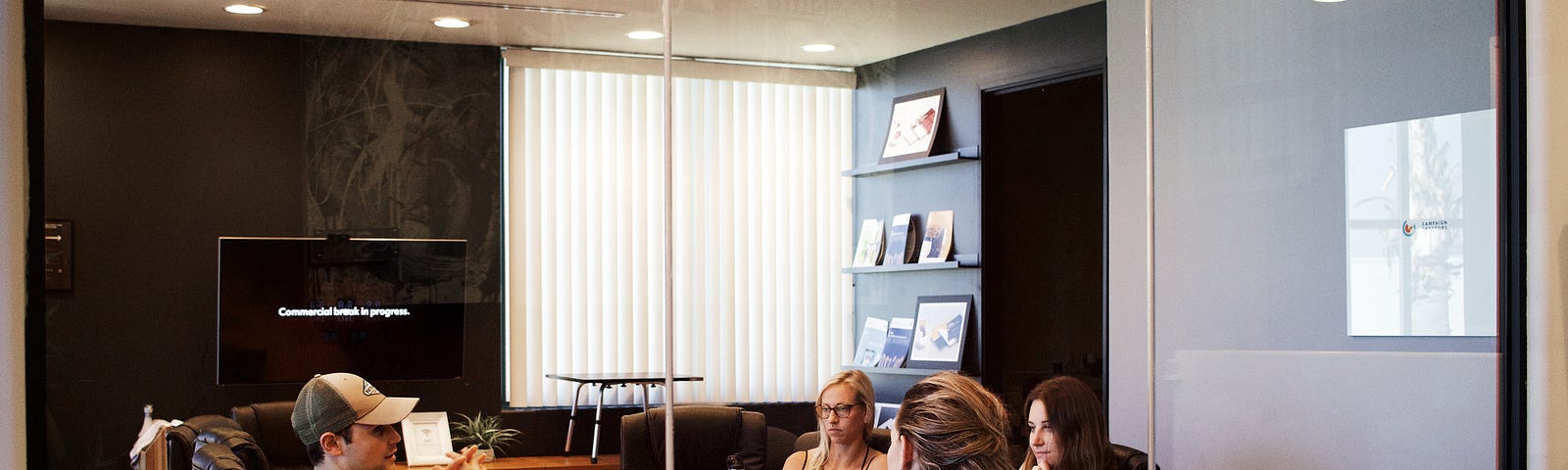 Lawyer sitting around a corporate table.