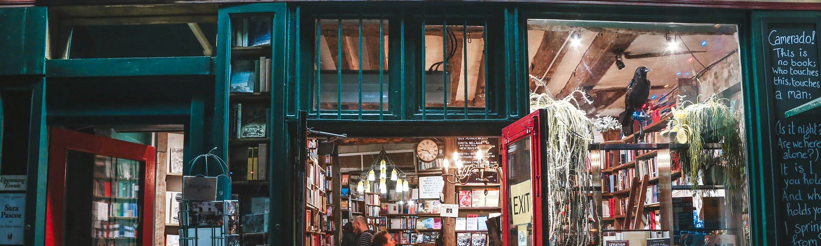 color photograph of the open front door and shop windows of Shakepeare and Company bookstore