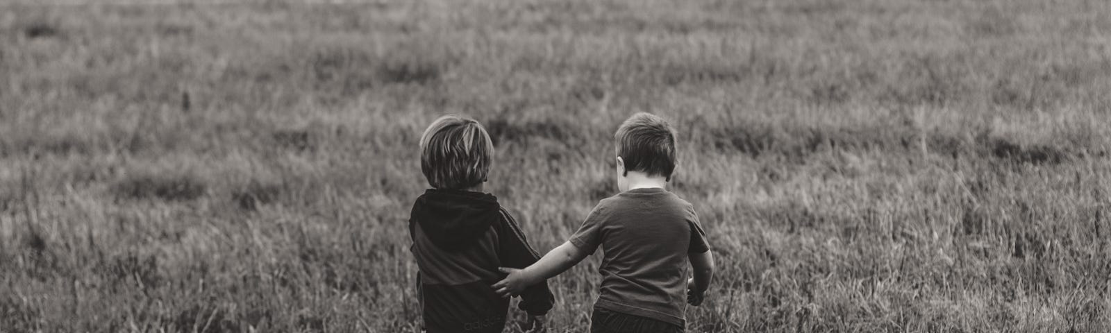 Two very adorable young boys (?), headed to a future full of mutually enabled sex crime.