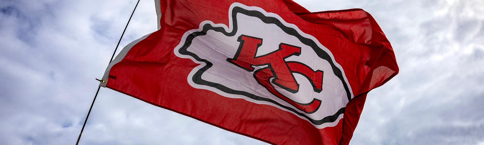 A Kansas City Chiefs flag waves proudly in a Kansas City neighborhood for the Super Bowl champs.