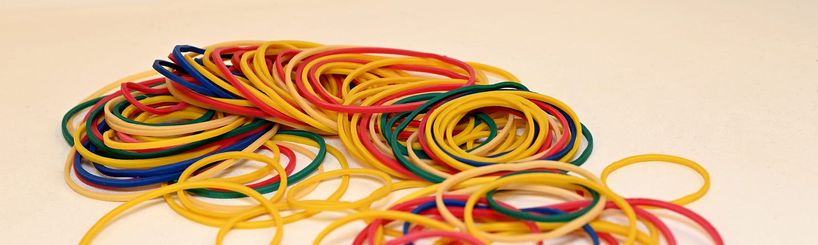 A pile of elastic bands on a white background
