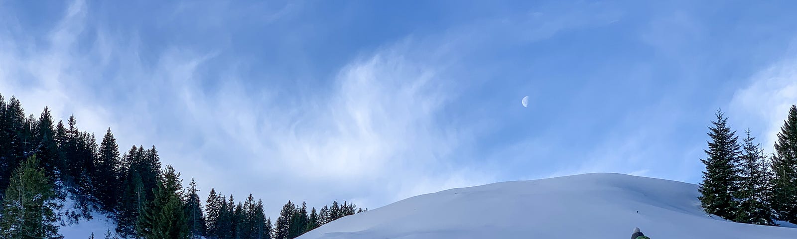 Figure climbing a snowy hill
