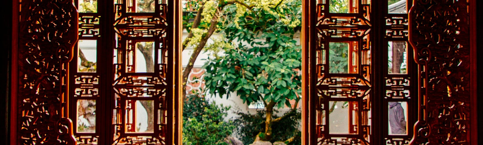 An open lattice-work door into a garden