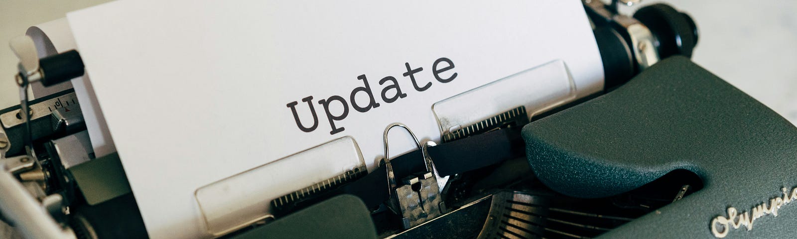A typewriter with the word “update”