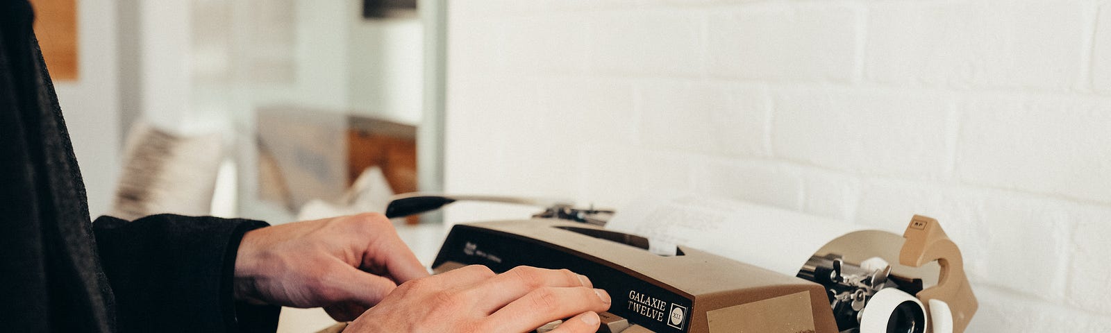 Picture of hands typing on a typewriter