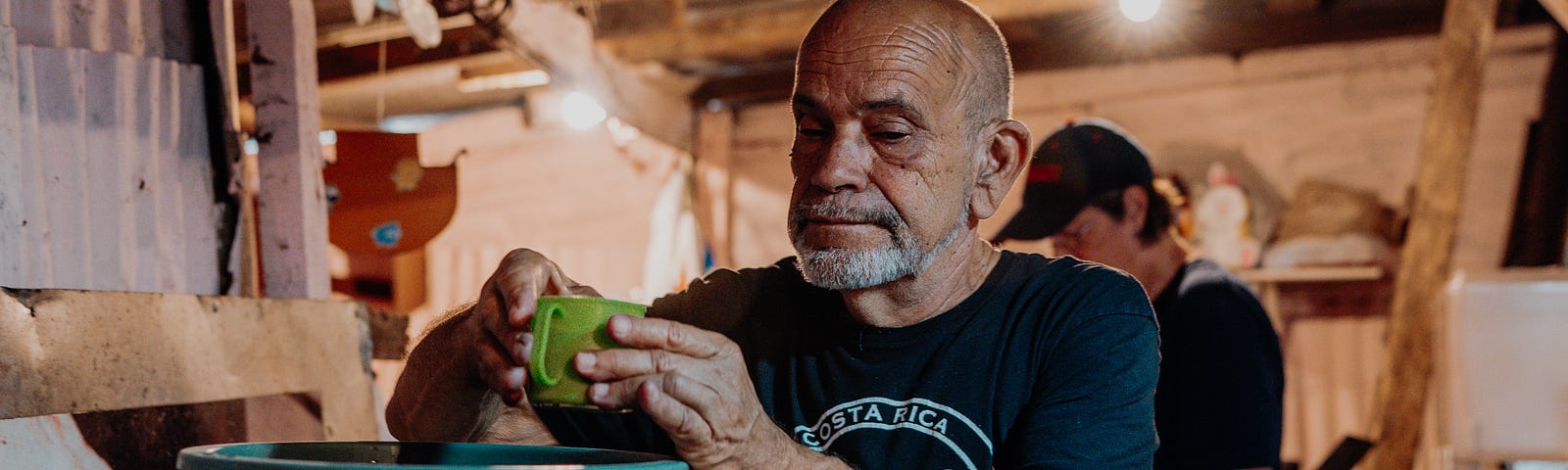 Here is a picture of a man preparing meals for those needing a warm meal, symbolizing a giving and caring heart.