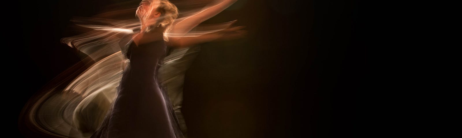 A woman dancing in slow and fast motion. There is time slip editing to make her appear in one place and many places at the same time.