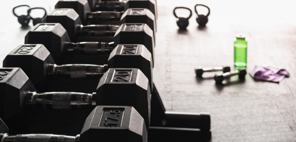 Weights lined up in a gym