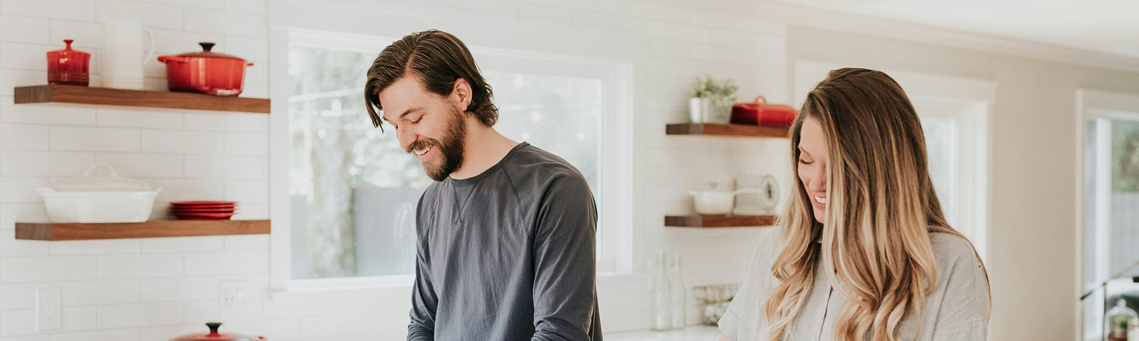 happy couple cooking together in the kitchen