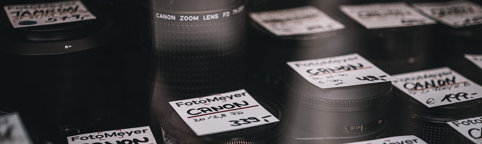 Camera lenses on display with prices